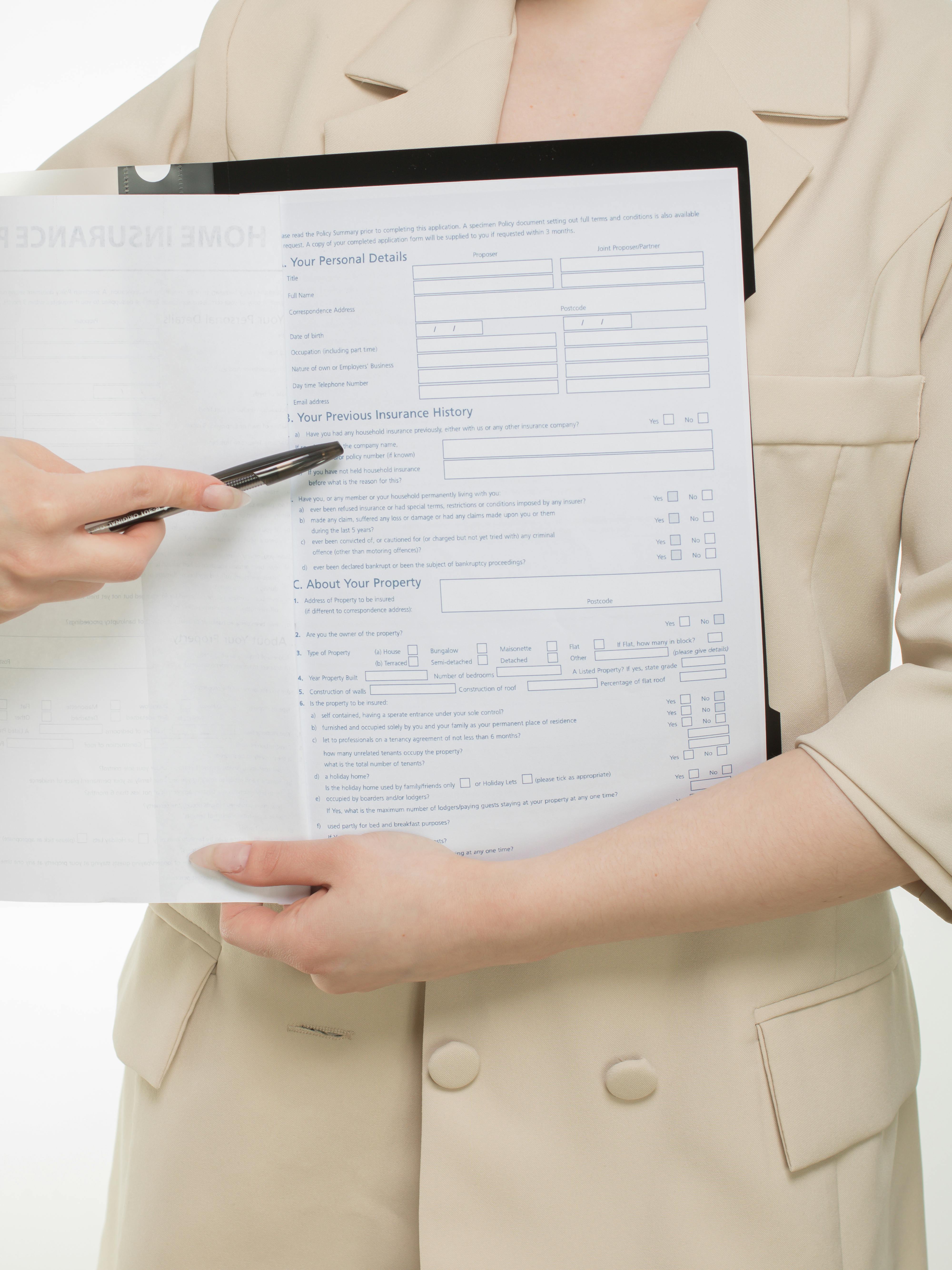 Insurance policy folder and car model showing coverage planning